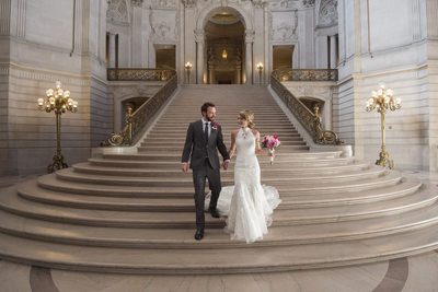 Bride and Groom walking down the Grand Staircase in SF