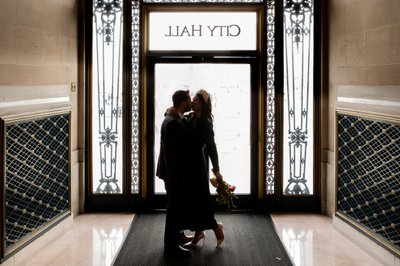 Silhouette image of newlyweds leaving San Francisco city hall