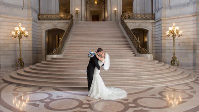 Bride and Groom Kiss with SF City Hall  Rotunda in Background