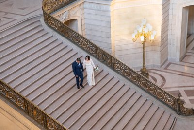 SF City Hall Newlyweds Walking down the Grand Staircase
