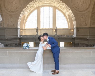 Filipino Newlyweds kissing at City Hall - Wedding Photography