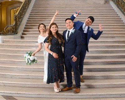 San Francisco city hall newlyweds having fun with their guests