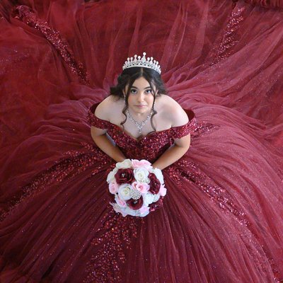 Headshot of Quinceanera surrounded by her dress - SF City Hall
