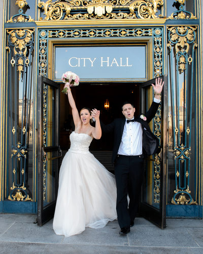 Happy couple celebrate at San Francisco City Hall