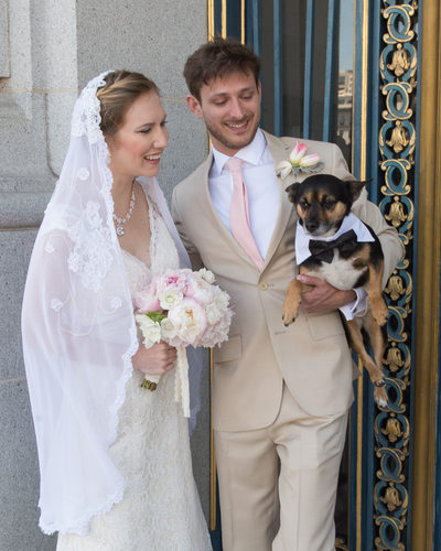 Bride and groom  with their dog wearing a tux