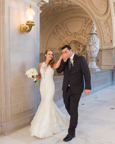 Candid photo of Newlyweds after wedding ceremony at San Francisco city hall