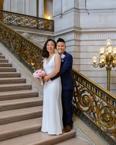LGBTQ+ couple on the grand staircase