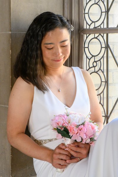 bride and her wedding flowers at City Hall