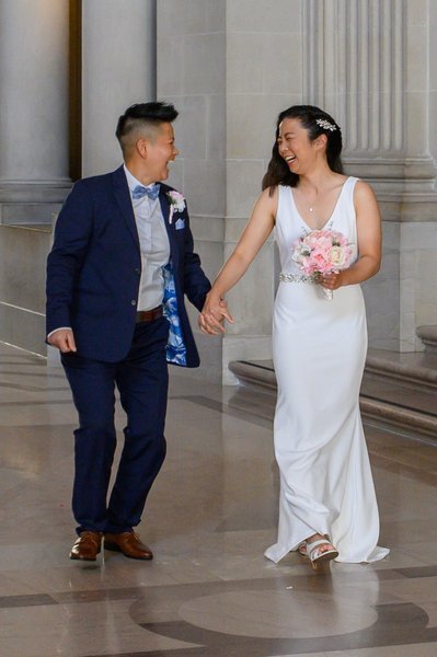 Laughing newlyweds at City Hall