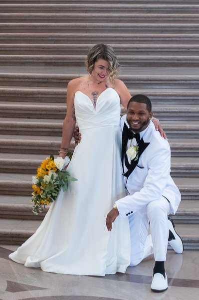 SF City Hall bride and groom enjoying the Grand Staircase