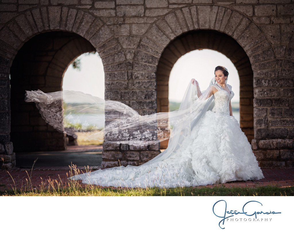 Graceful Bride Under Stone Arches