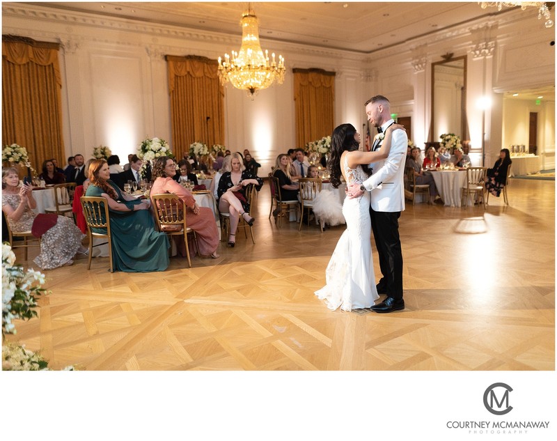 Bride and groom dancing at the Nixon Library