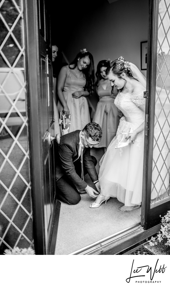 Bride Putting Shoes On