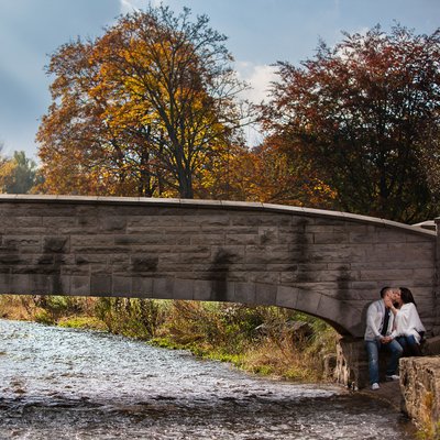 Engaged Couple Under the Bridge at Websters Falls 