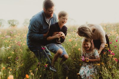 Family photos in a wildflower field at Mayberry Farms