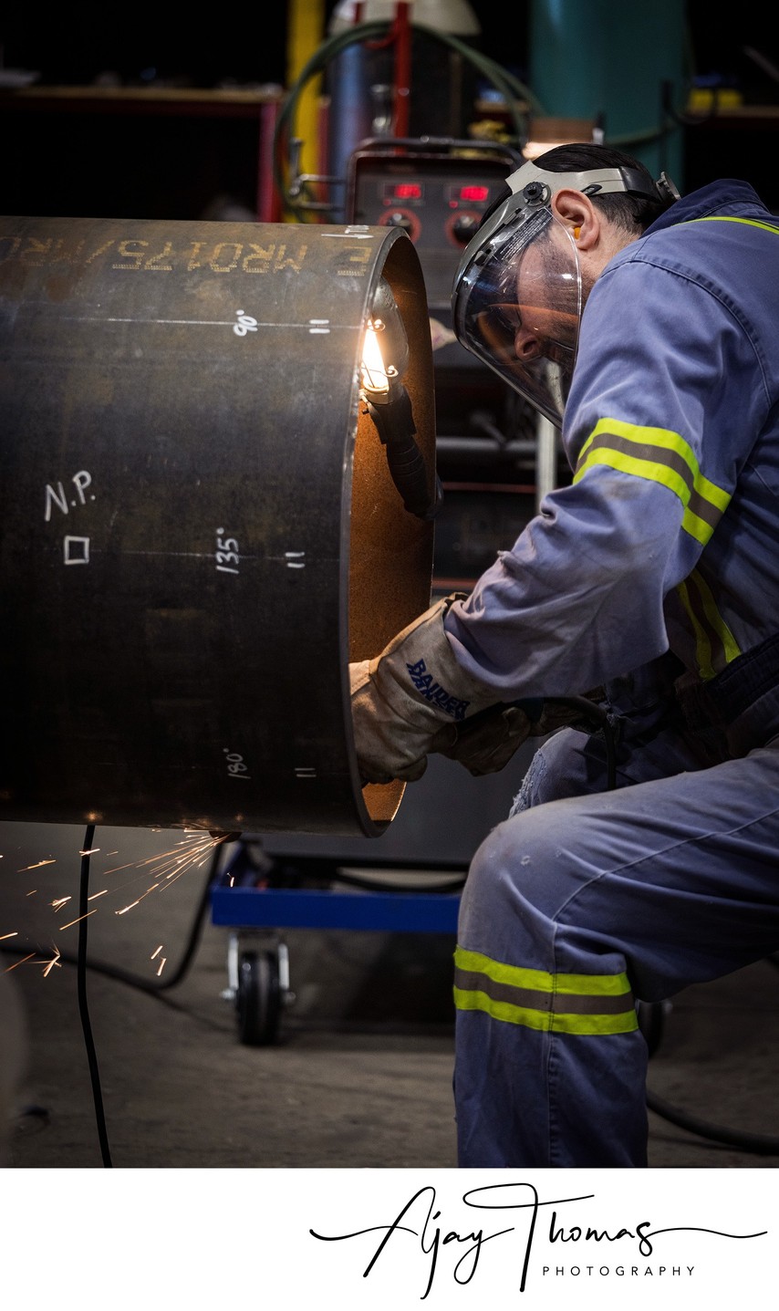  electric wheel grinder creating shower of sparks.