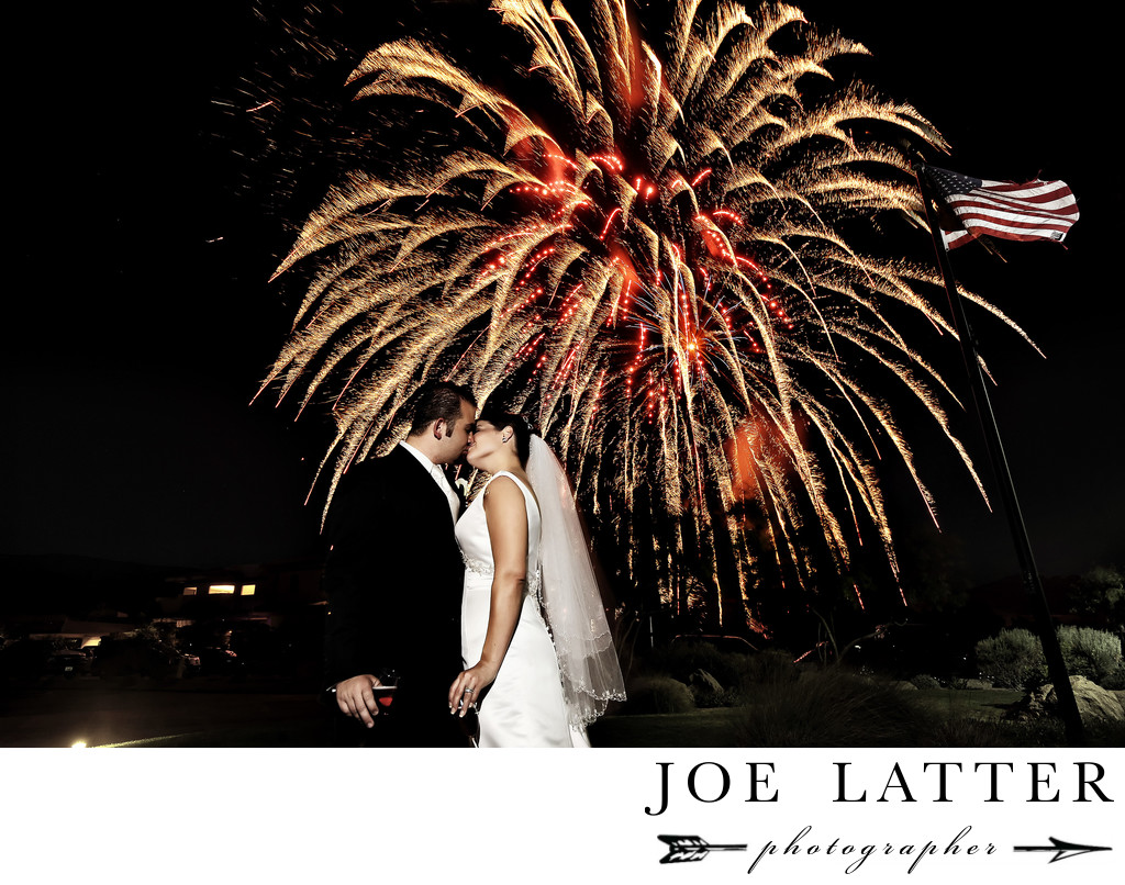 Amazing image of bride and groom kissing on Fourth 4thof July with fireworks at DragonRidge Golf Club in Henderson, Nevada.