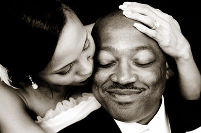 Beautiful black and white wedding image of African American man and his Asian bride.