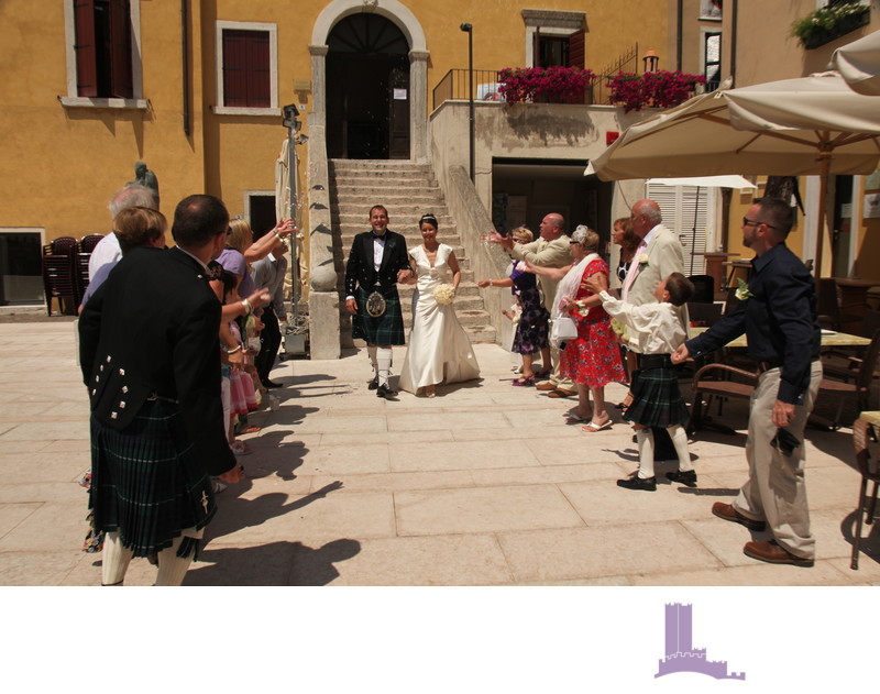 Wedding couple leaving Garda Town Hall, Italy