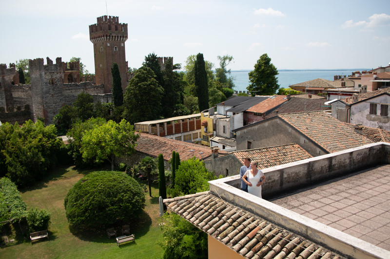 The bride and groom on the roof top in Lazise