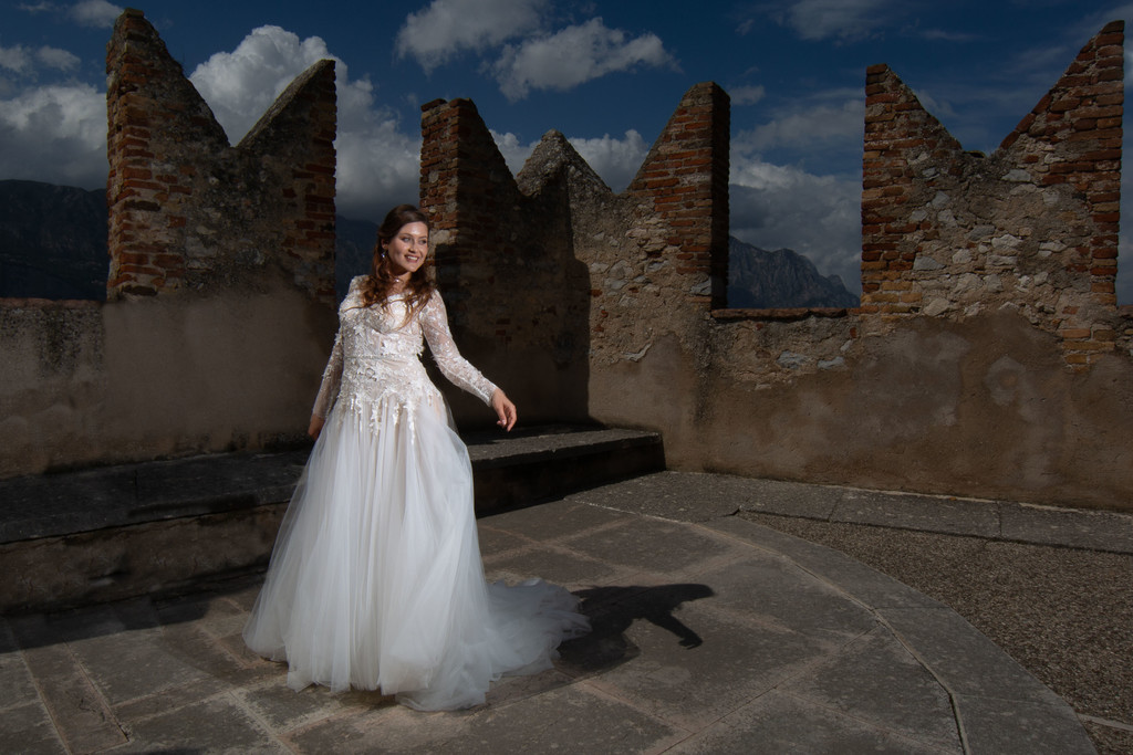 bride and the castle turrets in Malcesine