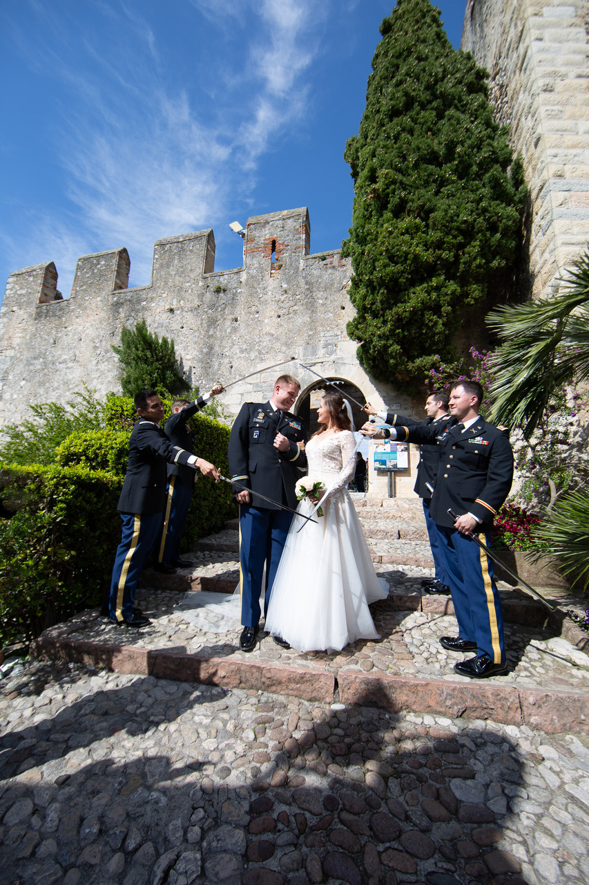 Military wedding with swords on Lake Garda