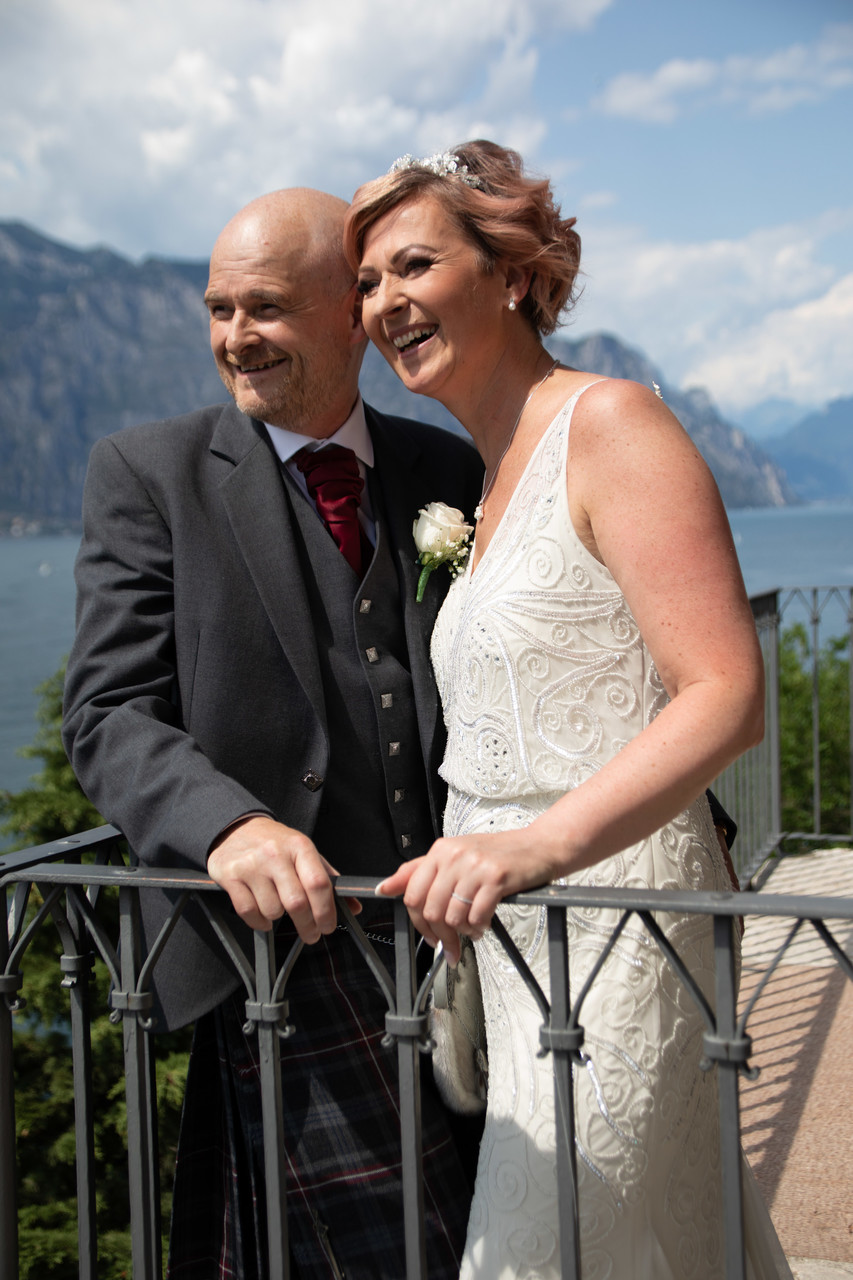 married couple on awesome balcony on Lake Garda, Italy