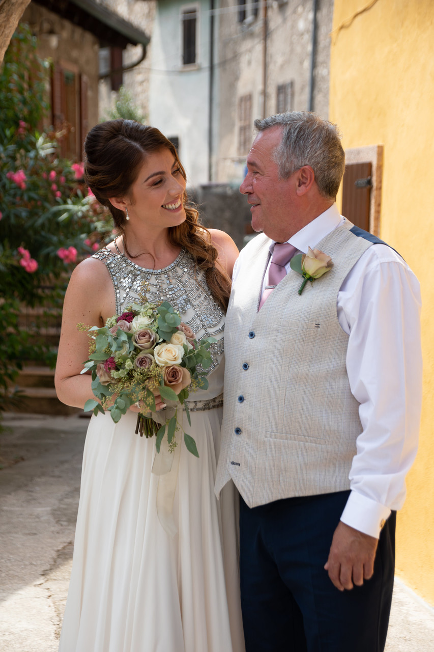 Gemma the bride with her dad before Malcesine Wedding.