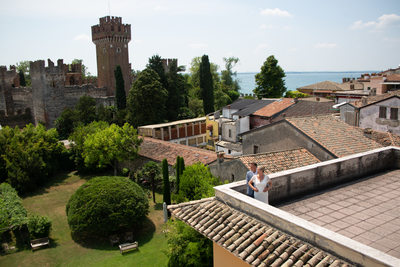 The bride and groom on the roof top in Lazise