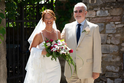 Superb, happy bride and her dad in Malcesine Streets