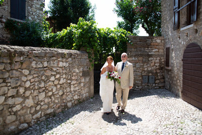 Superb bride and her dad in Malcesine Streets