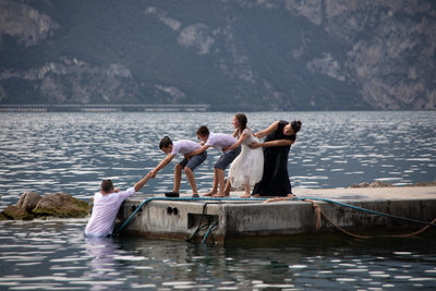 Helping the groom getting off the water on Lake Garda 