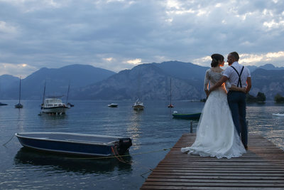 Bridal party on the jetty, Lake Garda, Italy.