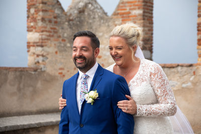 happy moments between the newly weds on Lake Garda
