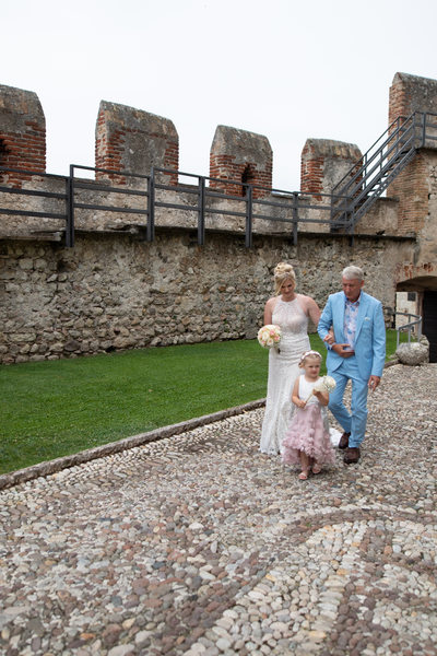 Family walking through Malcesine Castle.