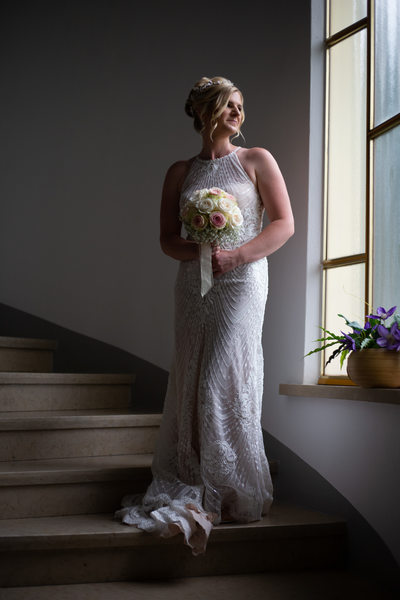 Elegant Julia before her wedding in Malcesine Castle.