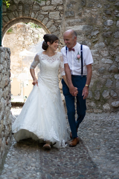 Dad and Lisa walking to the wedding, Malcesine Castle