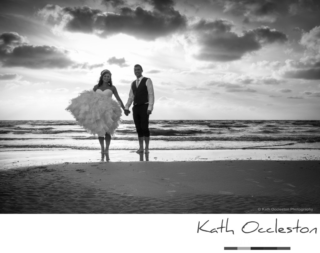 Bride & groom on the beach at Blackpool