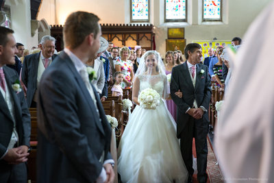 Groom sees bride in church