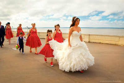 The bridal party walking along Blackpool Promenade