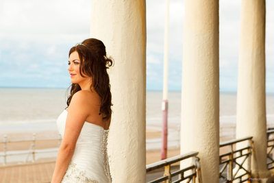 Bride looking out to sea on Blackpool promenade
