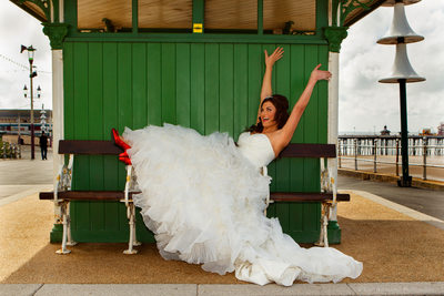 Bride in red shoes on Blackpool Promenade