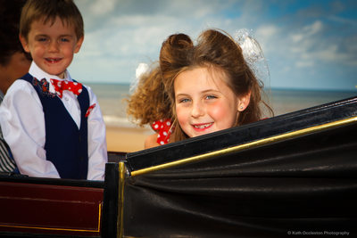 Flower girl in a horse drawn carriage