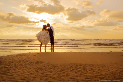 Bride & Groom on the beach at sunset