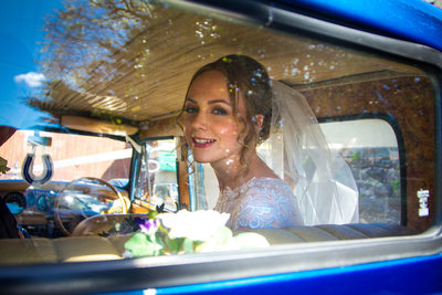 Candid portrait of the bride in the wedding car
