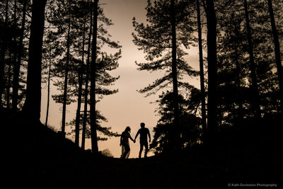 Sunset Silhouette of Bride & Groom in woods