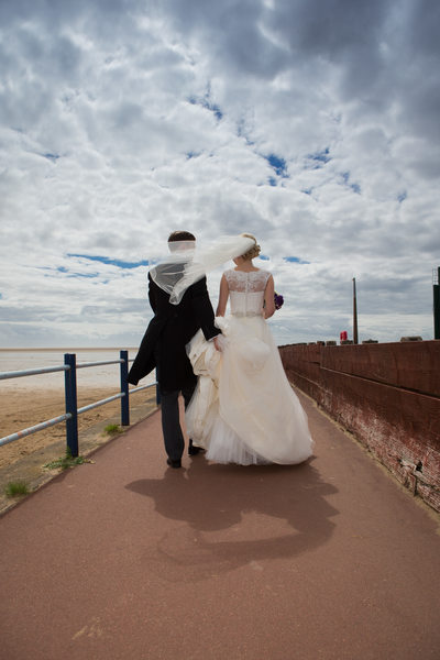 Windy wedding day photography in St Annes on Sea
