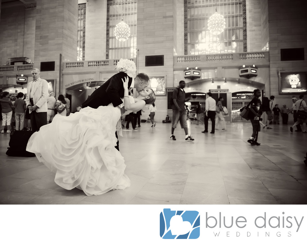 Wedding couple dip and kiss in Grand Central Terminal 