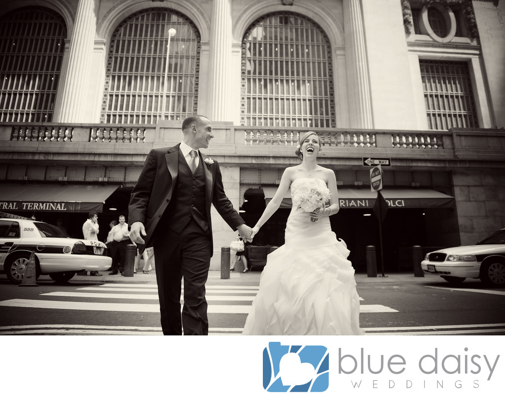 Bride groom walking laughing in front of Grand Central