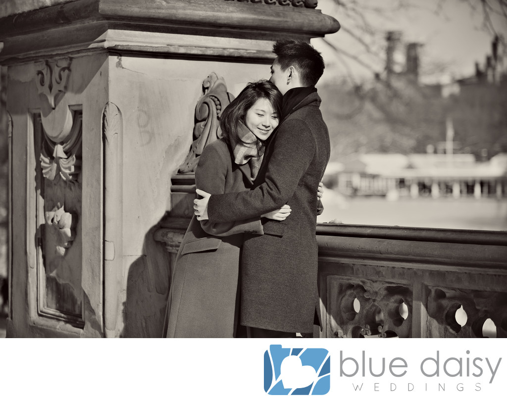 Newly engaged couple sharing a hug at Bethesda Terrace